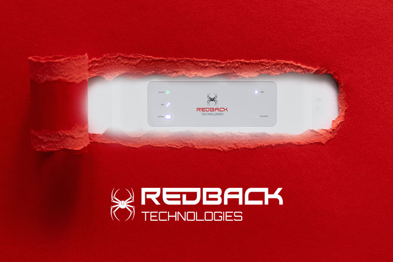 A ripped piece of red paper showing the redback technologies logo