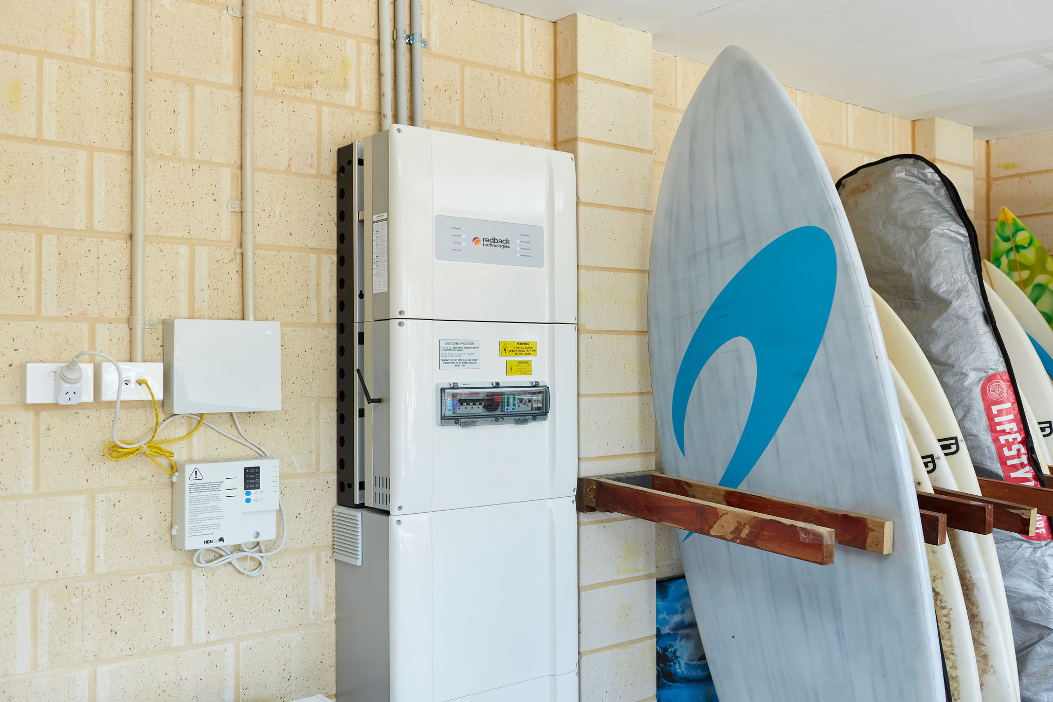 Redback Smart Battery installed in Australian garage with Surfboards