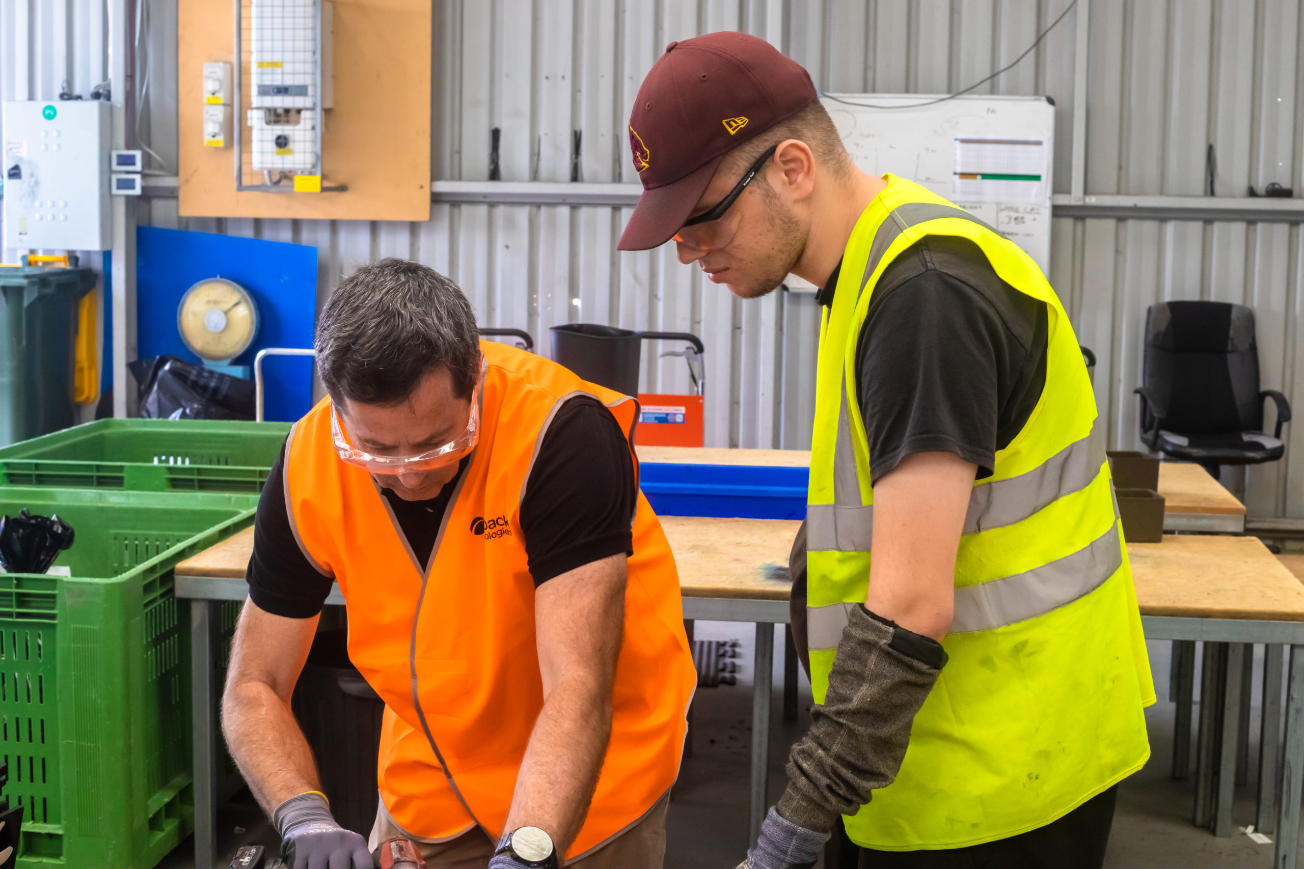 Redback and Endeavour Foundation Employees work to dismantle e-waste