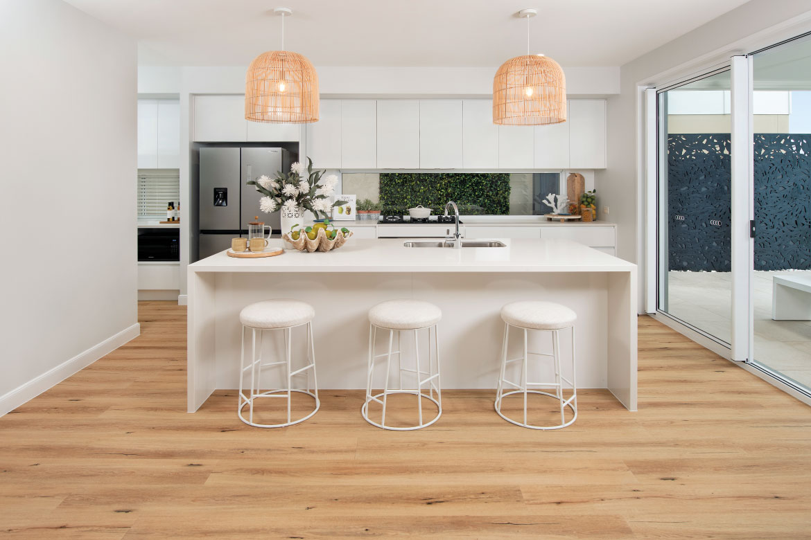 A light modern kitchen with feature lighting